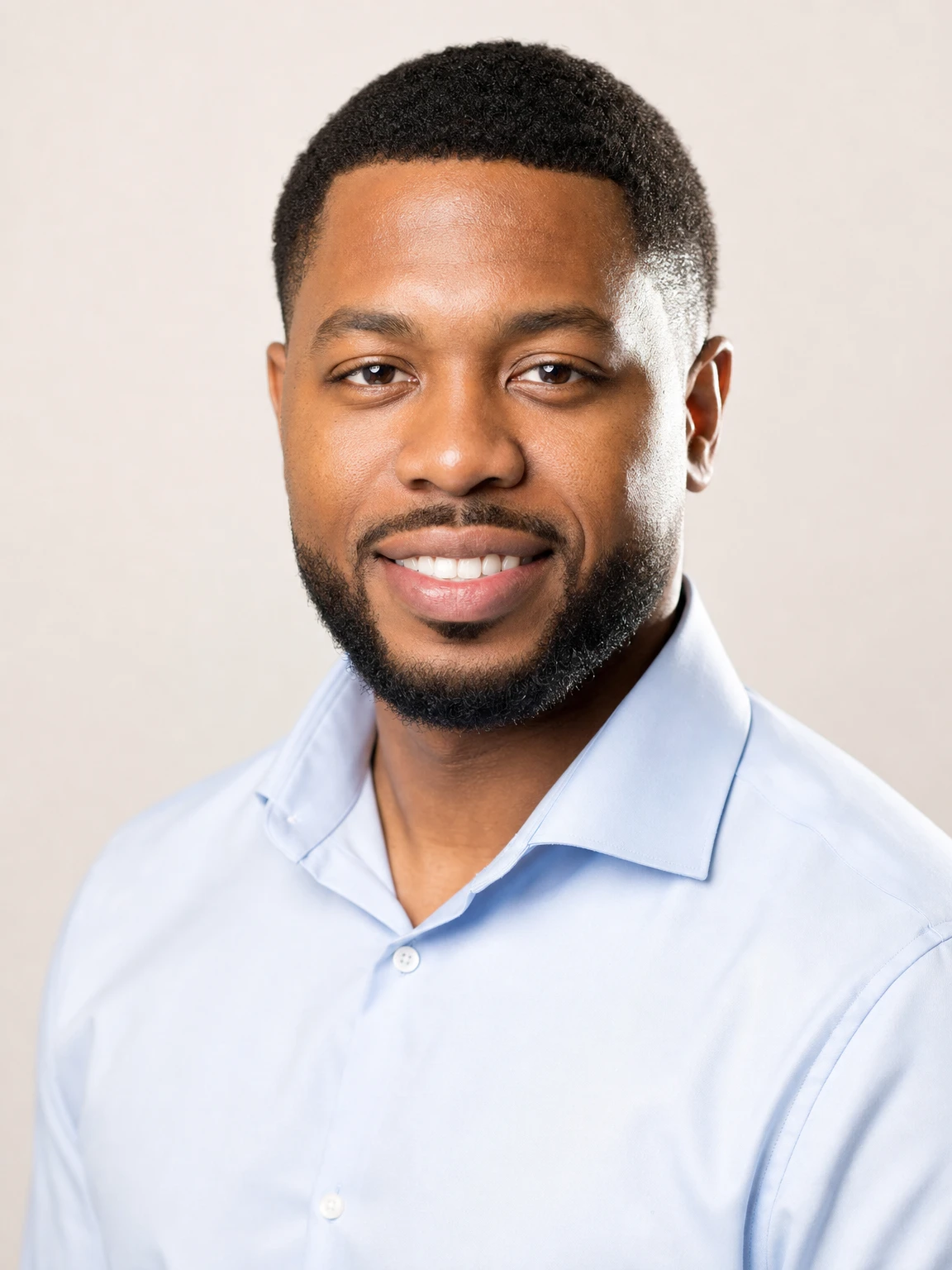 business casual headshot of a Black professional man